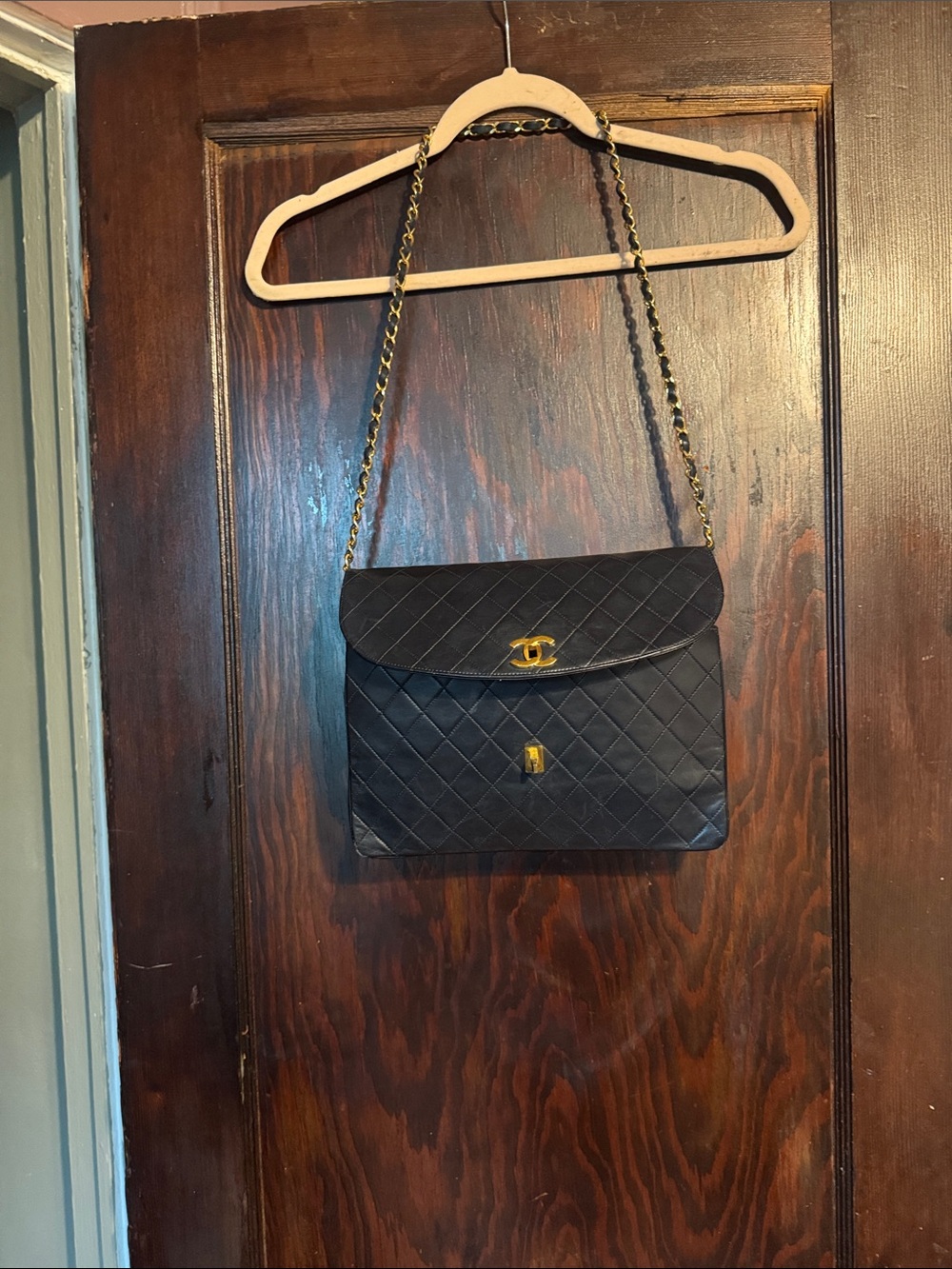 CHANEL Black Quilted Shoulder Bag with Gold Chain